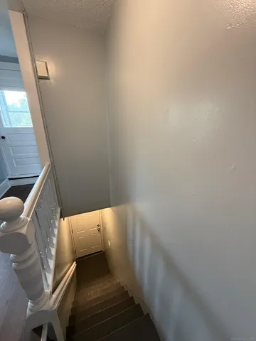 a view of hallway with wooden floor