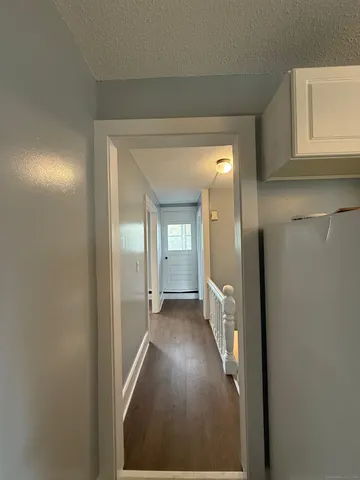 a view of a bedroom from the hallway