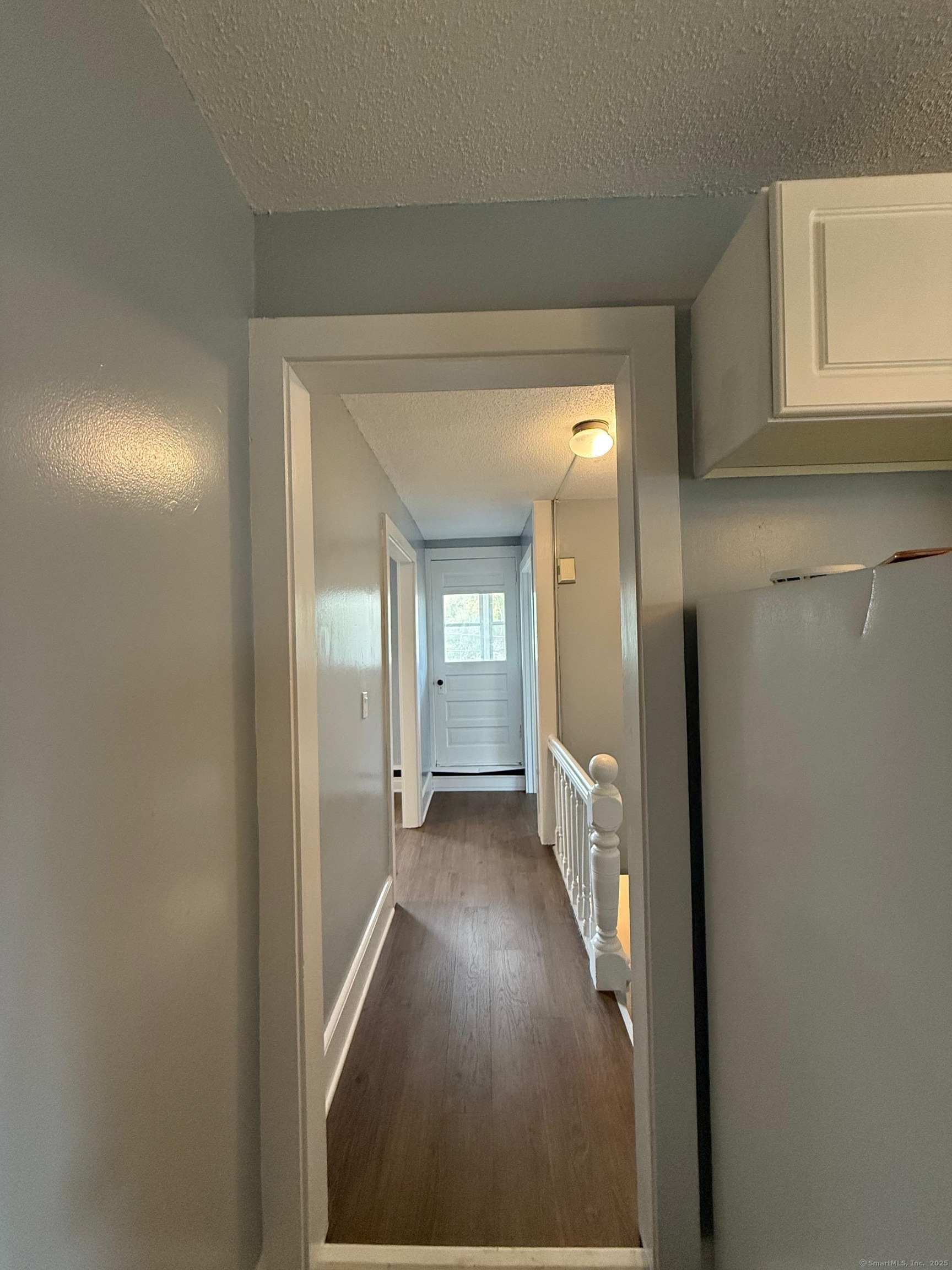 79 Spring Street, Unit 2 Middletown, CT 06457 - Photo 8 of 15 a view of hallway with wooden floor