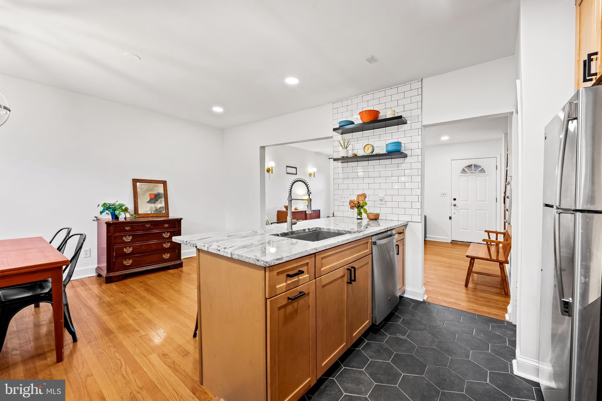 63 Burkshire Road Towson, MD 21286 - Photo 11 of 43 a kitchen with stainless steel appliances granite countertop a stove and a refrigerator