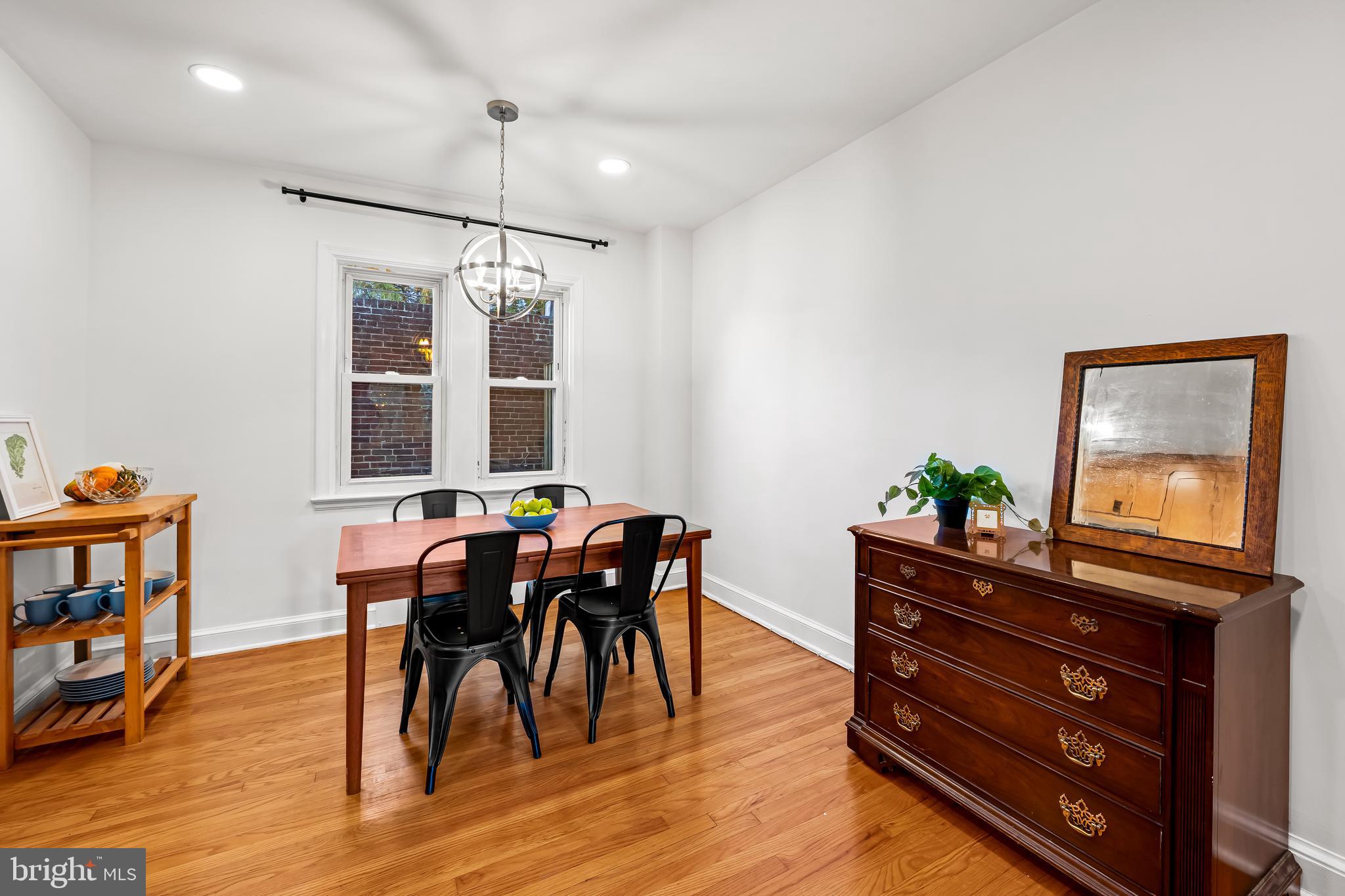 63 Burkshire Road Towson, MD 21286 - Photo 14 of 43 a view of a dining room with furniture and wooden floor