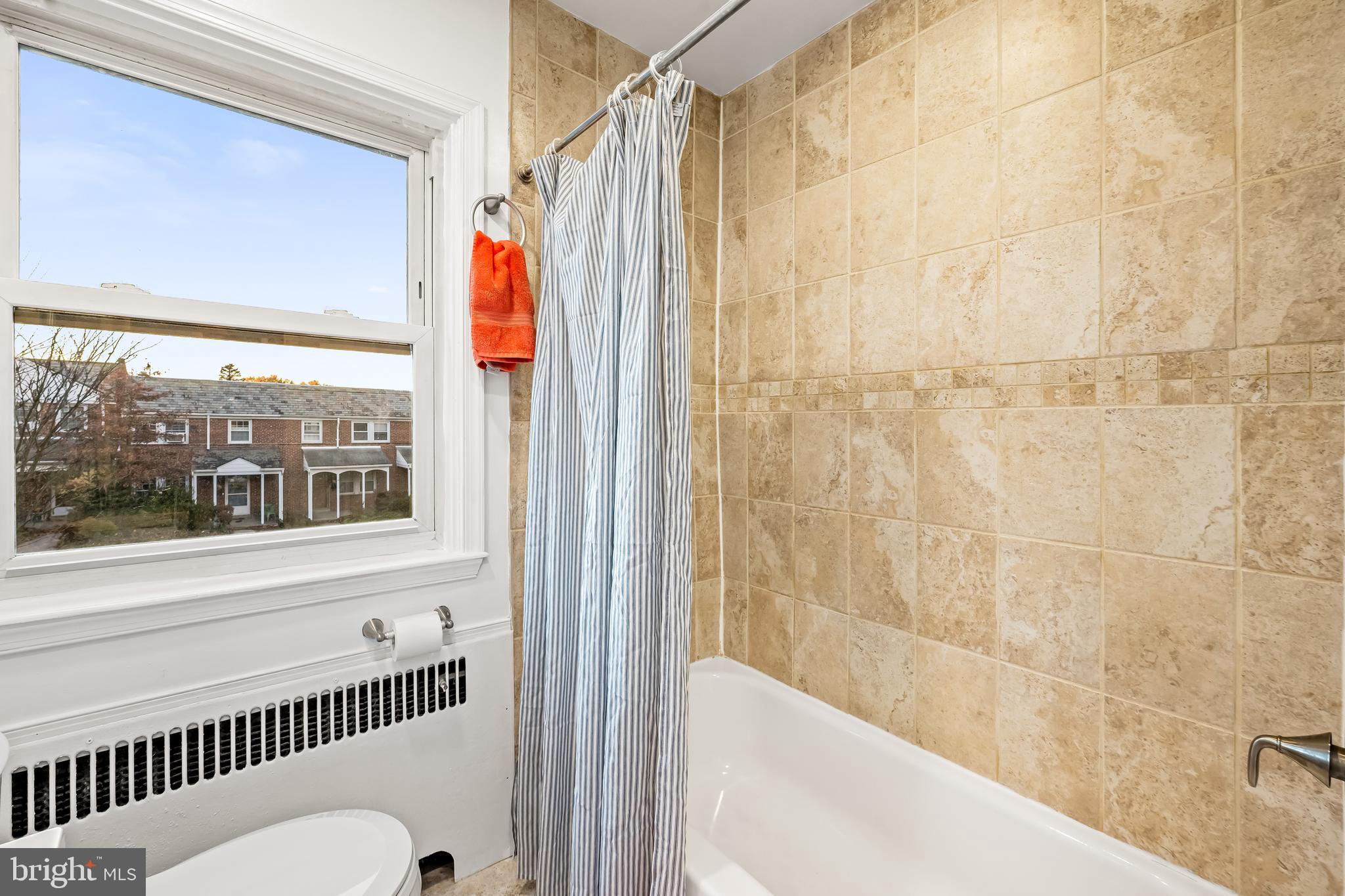 63 Burkshire Road Towson, MD 21286 - Photo 23 of 43 a bathroom with a bathtub and a shower