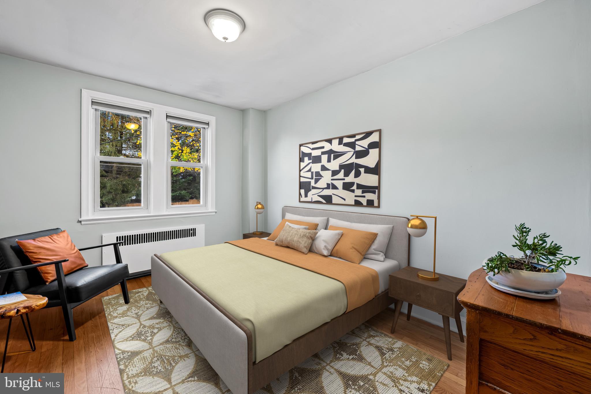 63 Burkshire Road Towson, MD 21286 - Photo 24 of 43 a bedroom with a bed and wooden floor