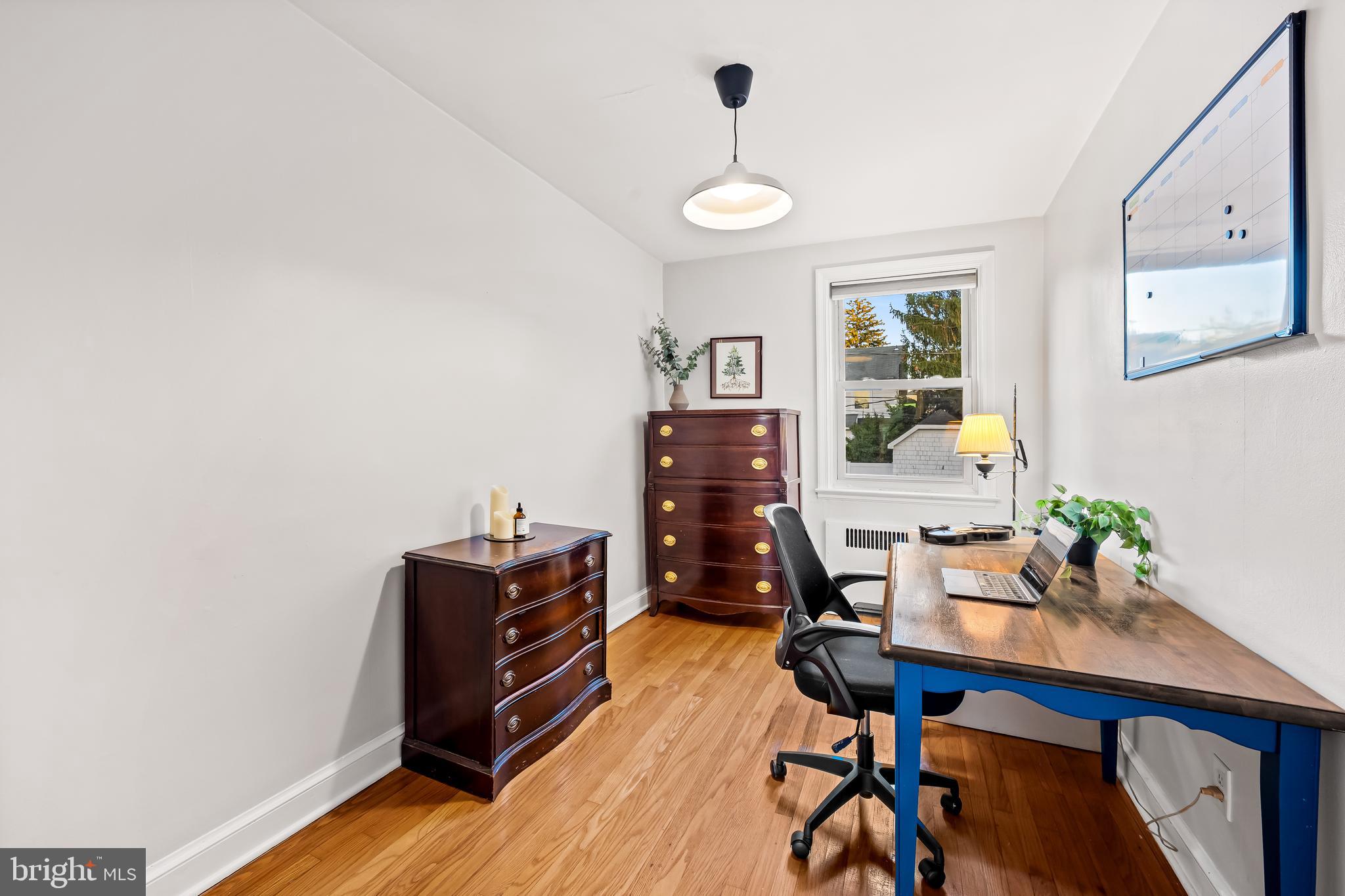 63 Burkshire Road Towson, MD 21286 - Photo 26 of 43 a view of a workspace with furniture and wooden floor