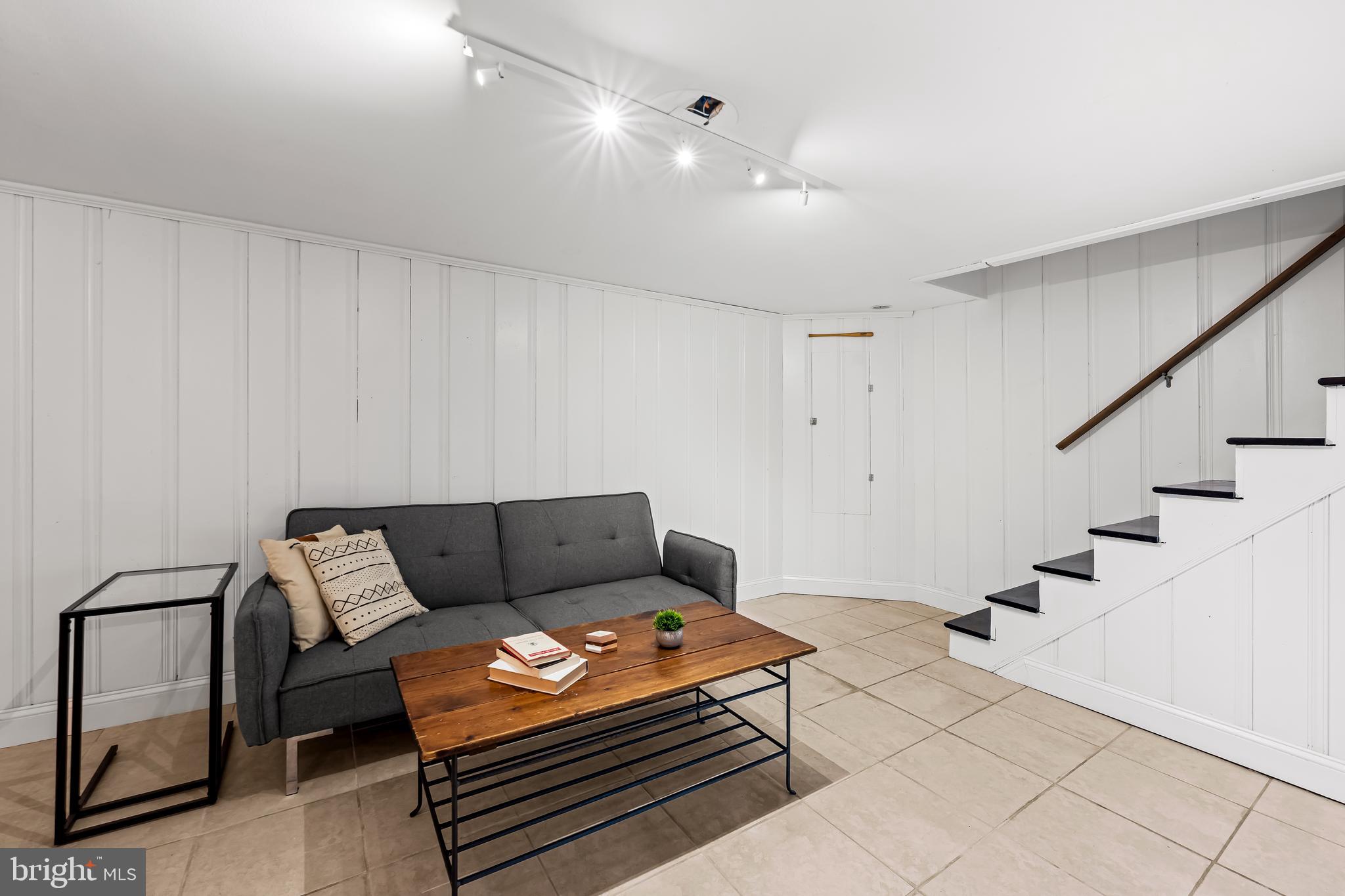 63 Burkshire Road Towson, MD 21286 - Photo 28 of 43 a living room with furniture and wooden floor