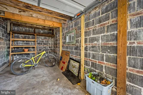 a street sign on a sidewalk next to a road