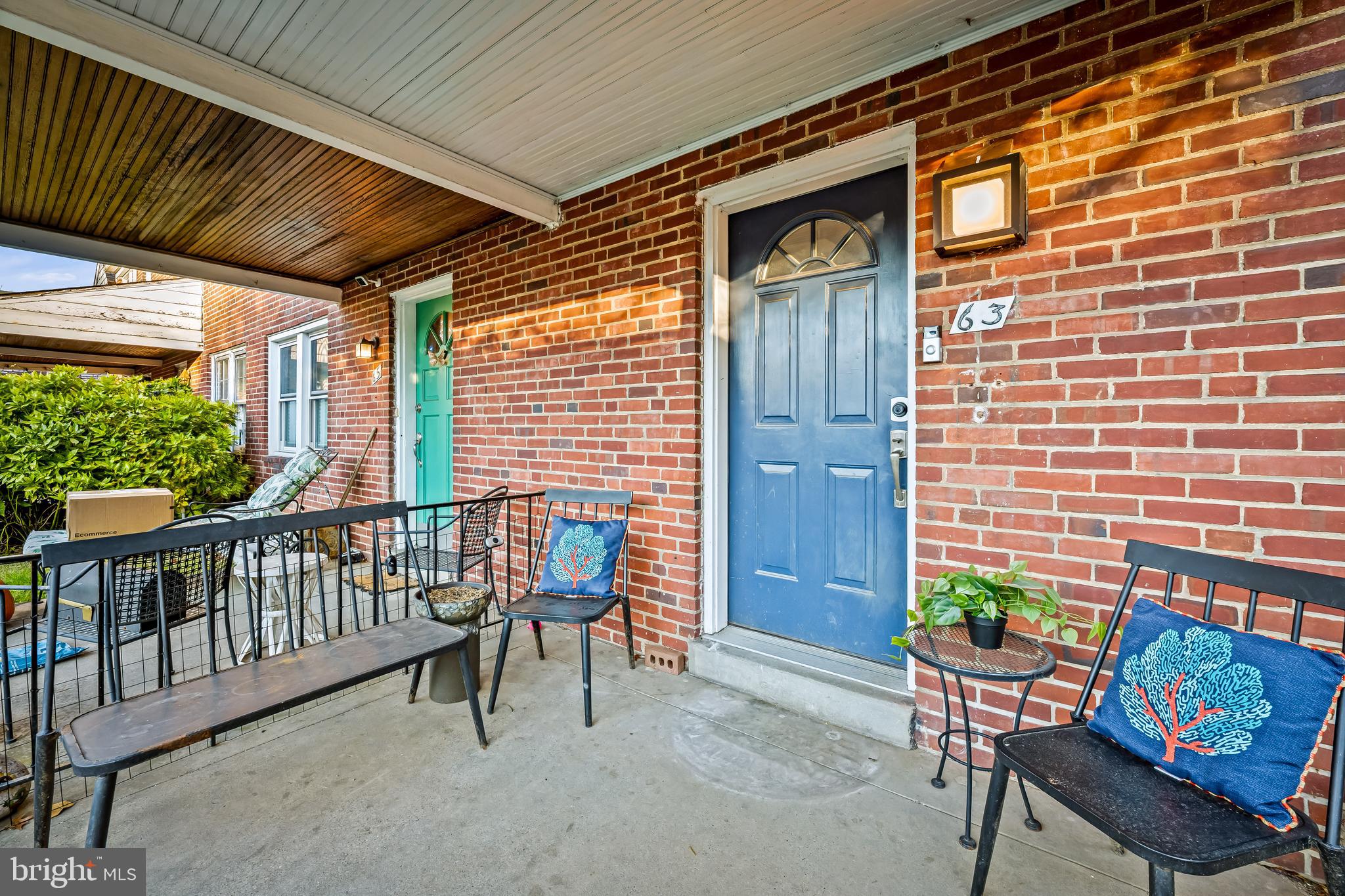 63 Burkshire Road Towson, MD 21286 - Photo 4 of 43 a balcony with furniture and potted plants