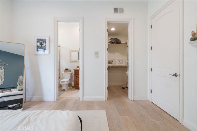 a kitchen with stainless steel appliances kitchen island granite countertop a refrigerator and a sink