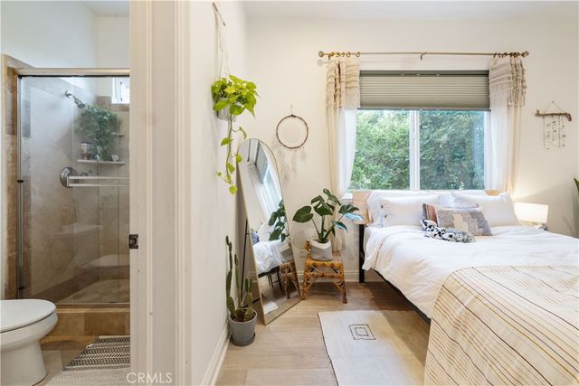 a view of a chair and table in the garden