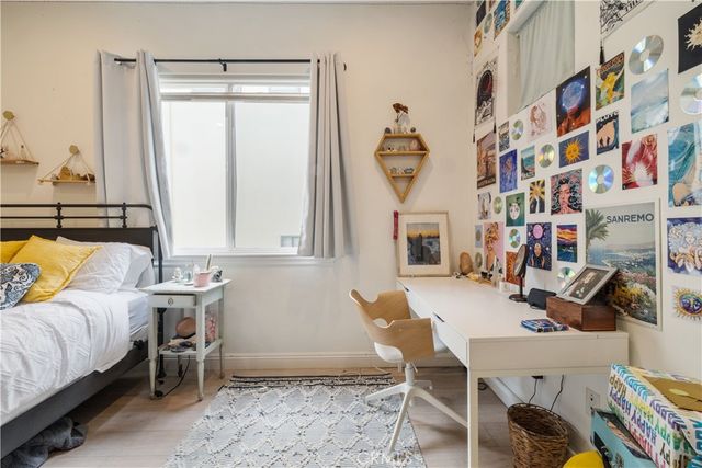 a roof deck with couch and chairs