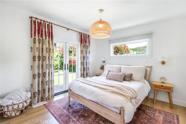 a bedroom with bed and a window