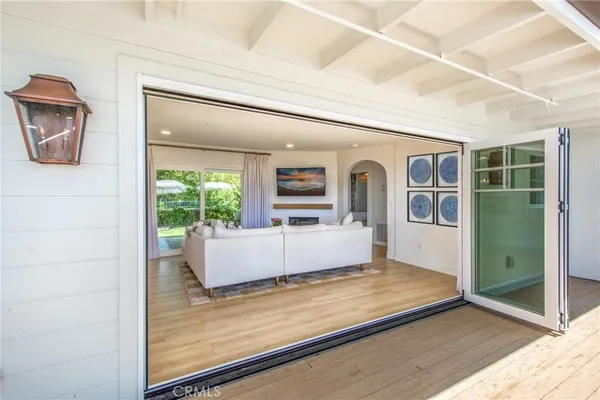 a view of living room kitchen with furniture and window
