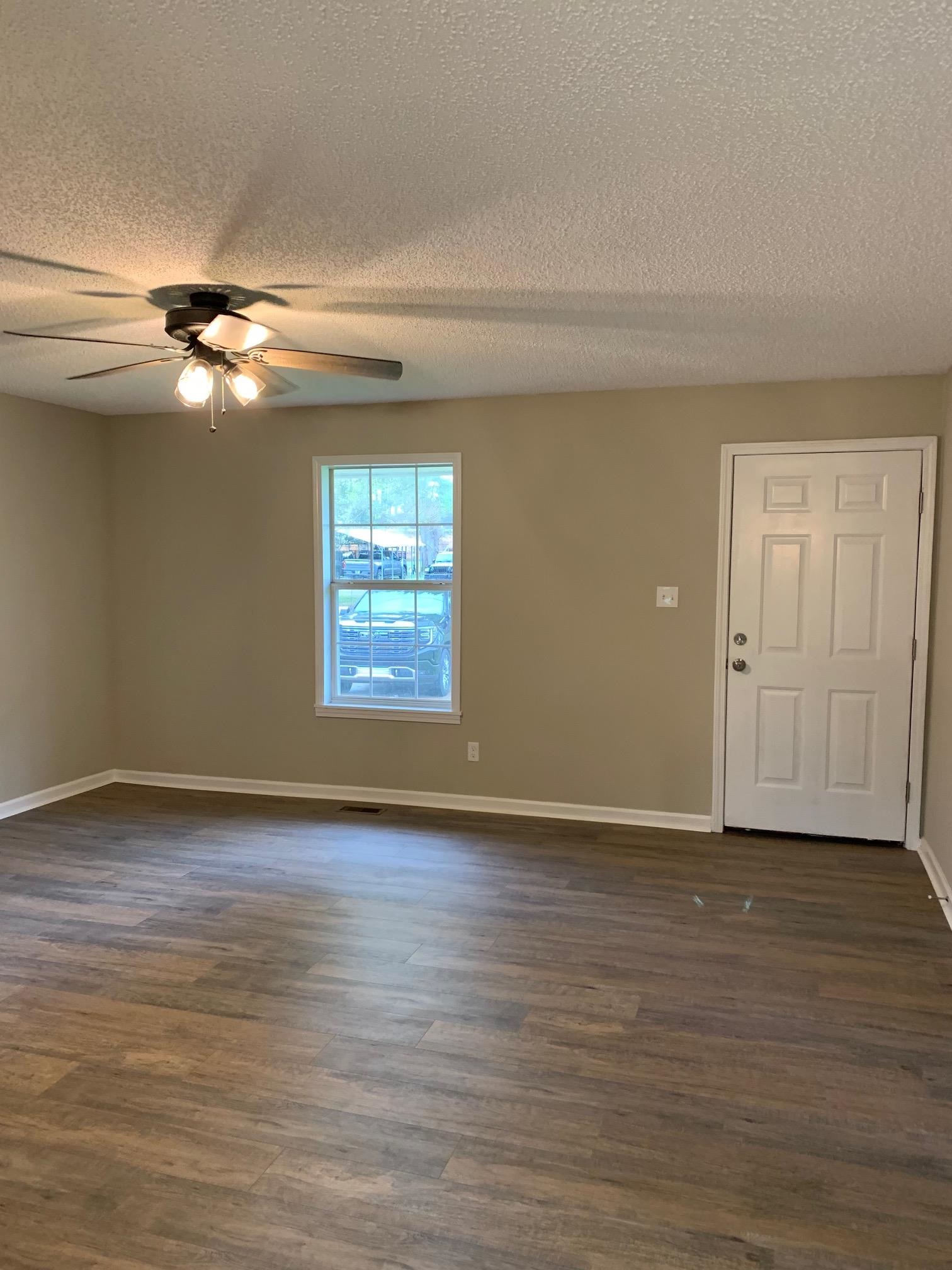 80 Halliburton Street Gates, TN 38037 - Photo 11 of 14 a view of empty room with wooden floor and fan