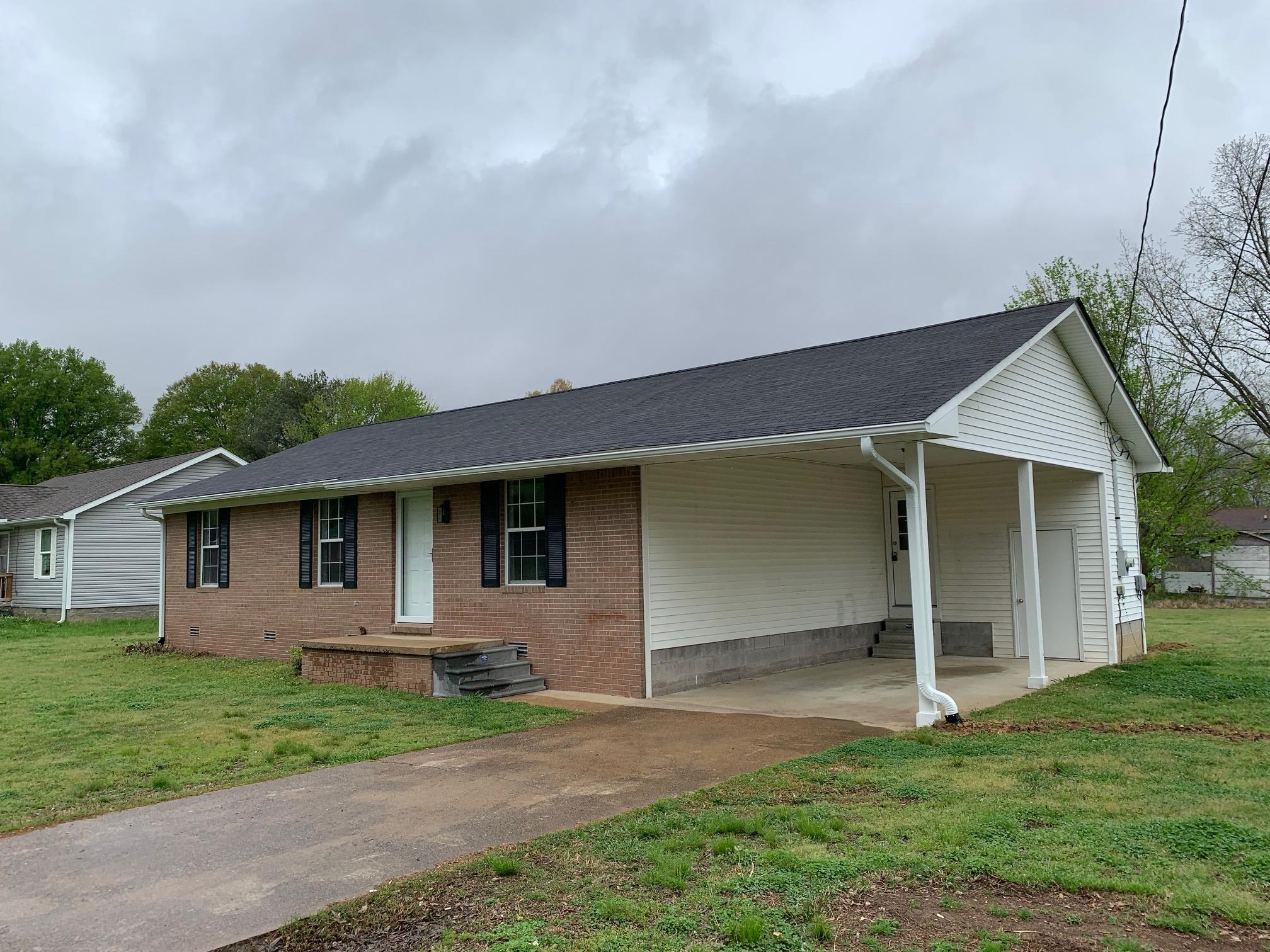 80 Halliburton Street Gates, TN 38037 - Photo 3 of 14 a front view of house with a garden