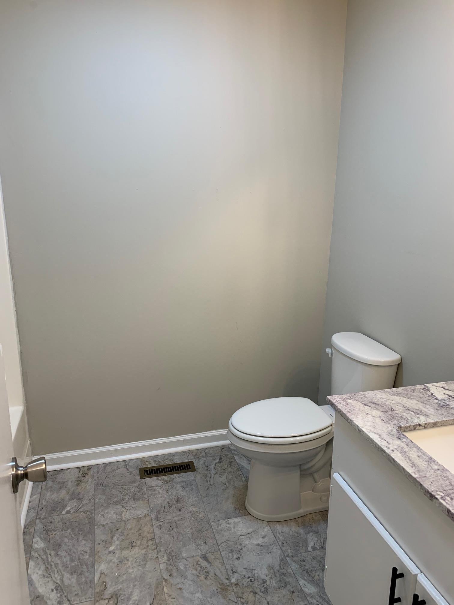 80 Halliburton Street Gates, TN 38037 - Photo 9 of 14 a white toilet sitting next to a sink