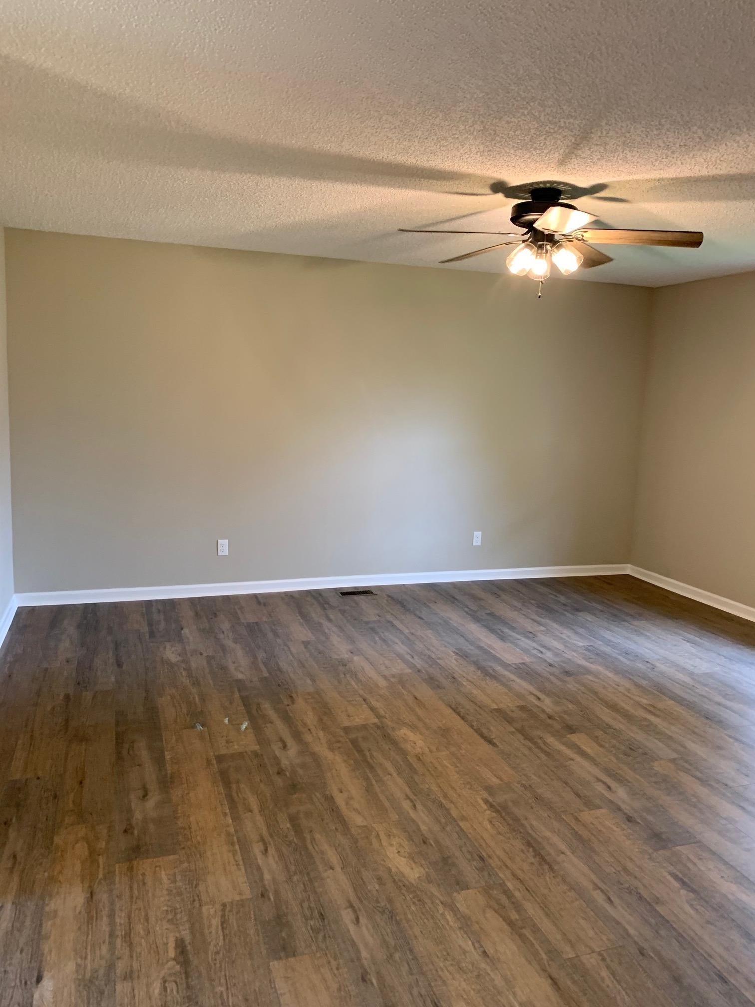 80 Halliburton Street Gates, TN 38037 - Photo 10 of 14 a view of a room with wooden floor and cabinet