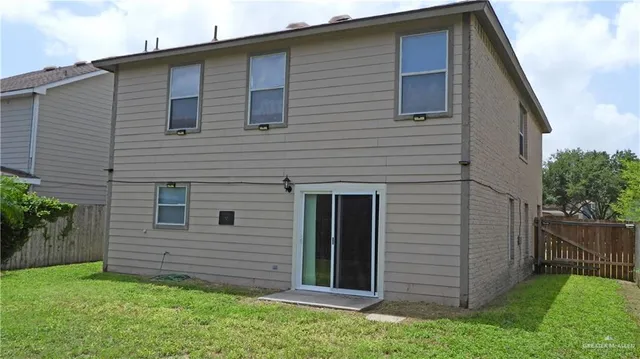 a view of a backyard of the house