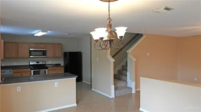 view of a dining room with furniture wooden floor and chandelier