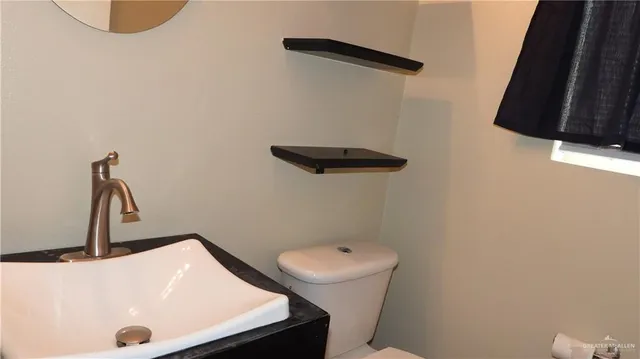a bathroom with a sink and a toilet