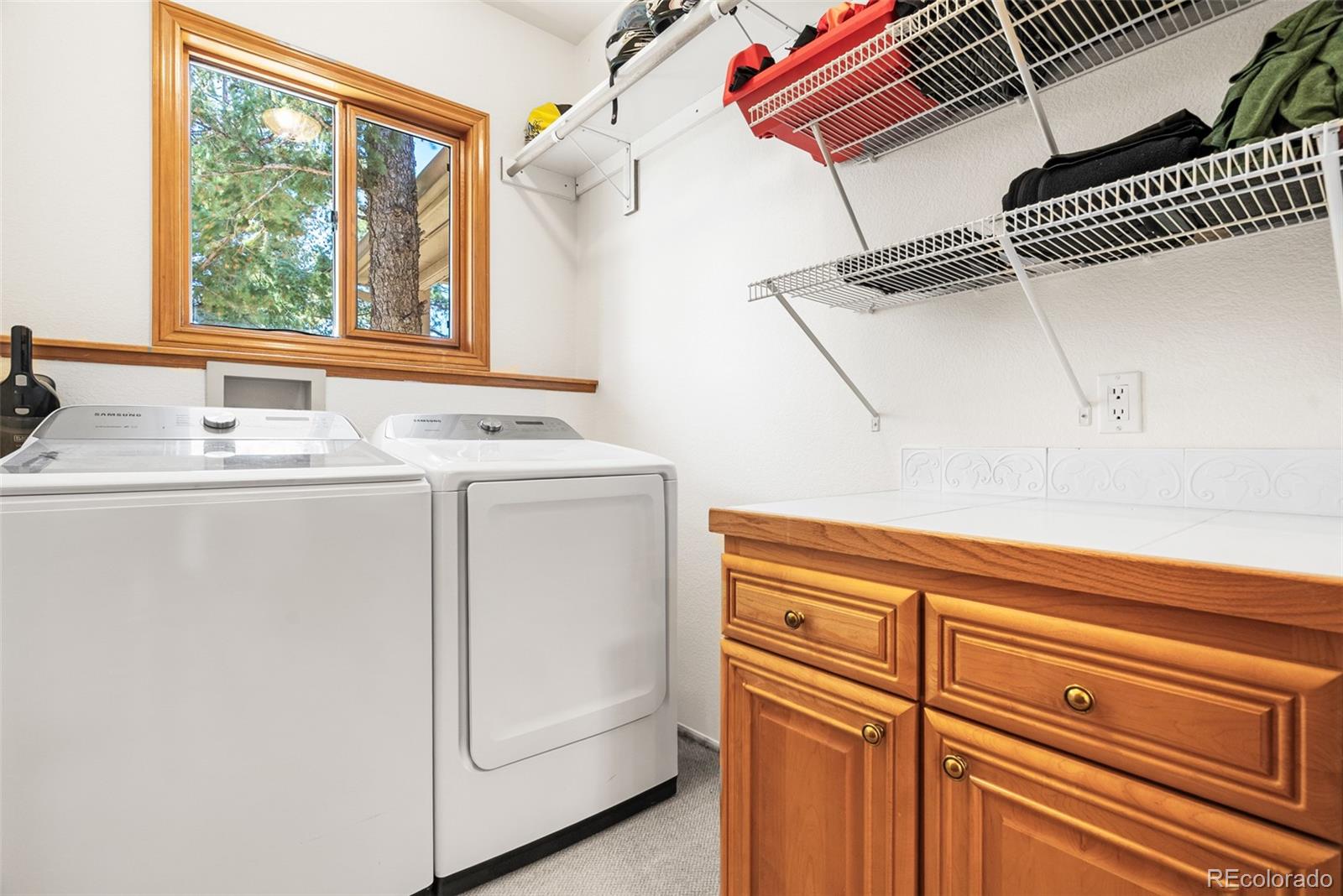 6252 King Drive Evergreen, CO 80439 - Photo 14 of 50 a utility room with dryer and washer
