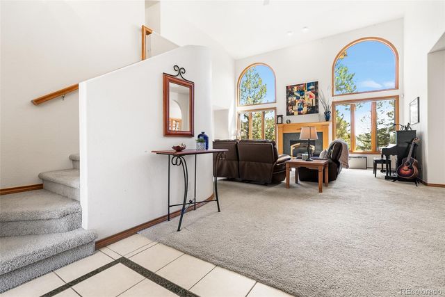 a view of living room with furniture and a window