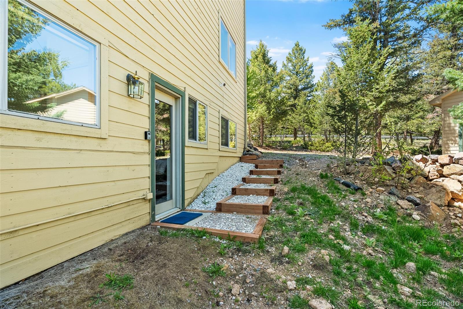 6252 King Drive Evergreen, CO 80439 - Photo 26 of 50 a view of a pathway with a house