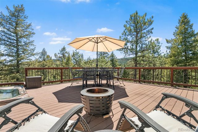 swimming pool view with a seating space