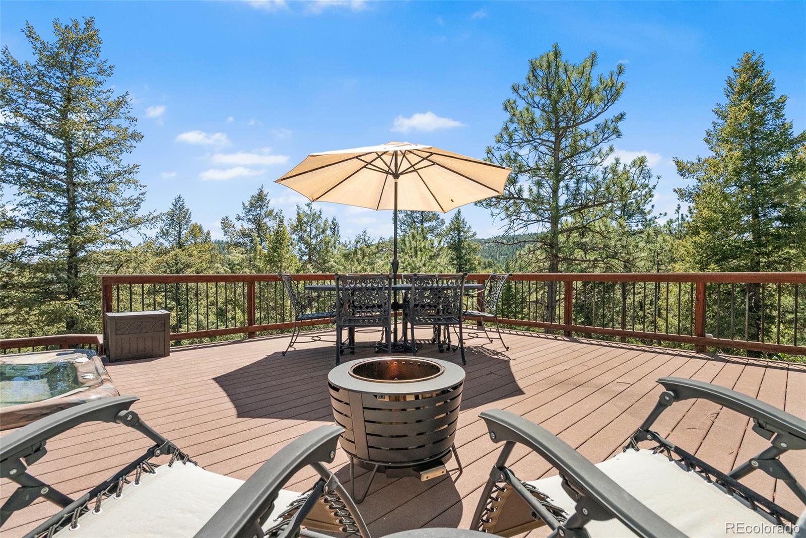 6252 King Drive Evergreen, CO 80439 - Photo 34 of 50 a view of a chairs and table in the balcony