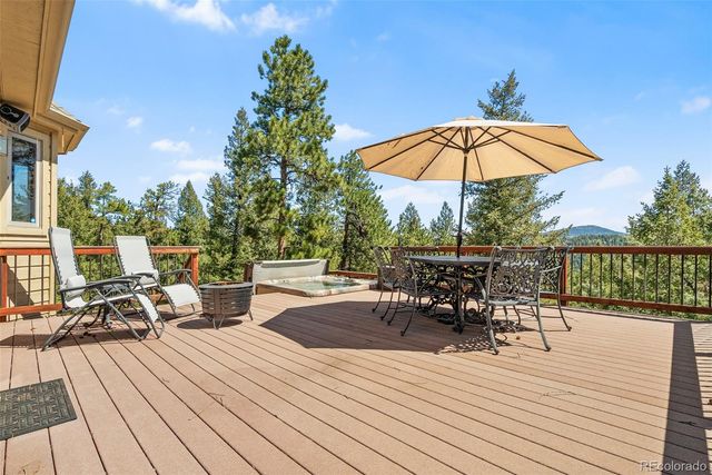 a patio with a patio table and chairs