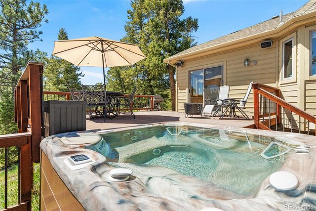a view of backyard of house and trees