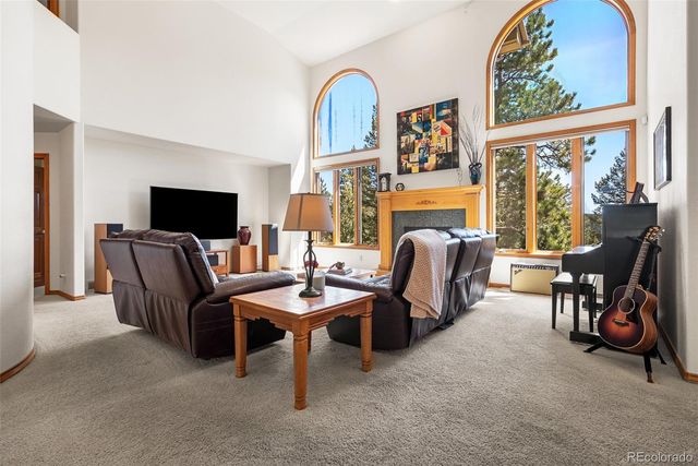 a view of a livingroom with furniture and a flat screen tv