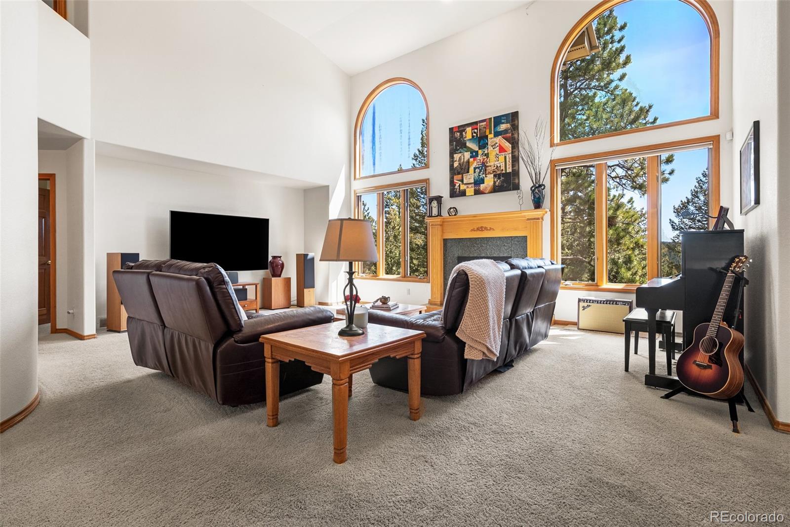 6252 King Drive Evergreen, CO 80439 - Photo 4 of 50 a view of a livingroom with furniture and a flat screen tv