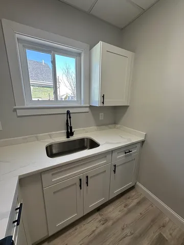 a kitchen with sink and window