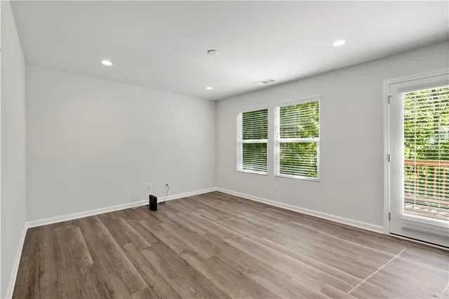 a view of kitchen with wooden floor and window