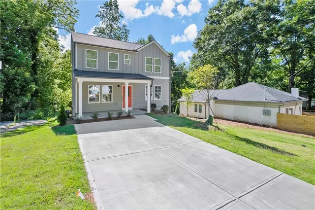 a front view of house with yard and green space