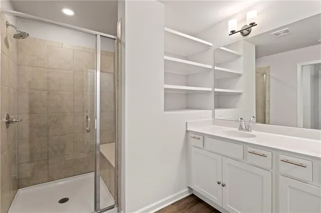 a bathroom with a double vanity sink and a mirror