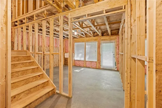 a view of an empty room with wooden walls