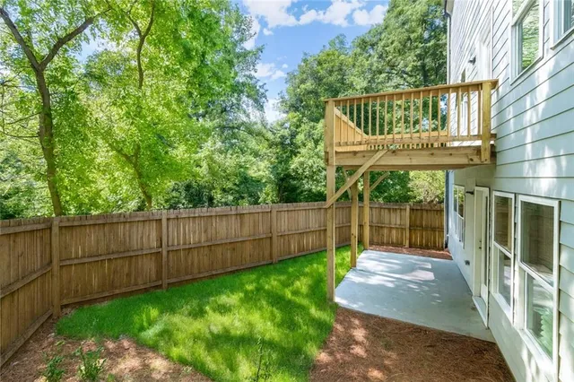 a view of backyard with green space
