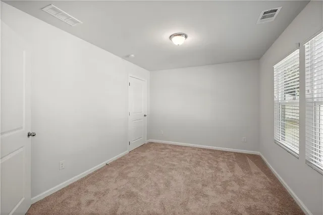a big room with windows and closet