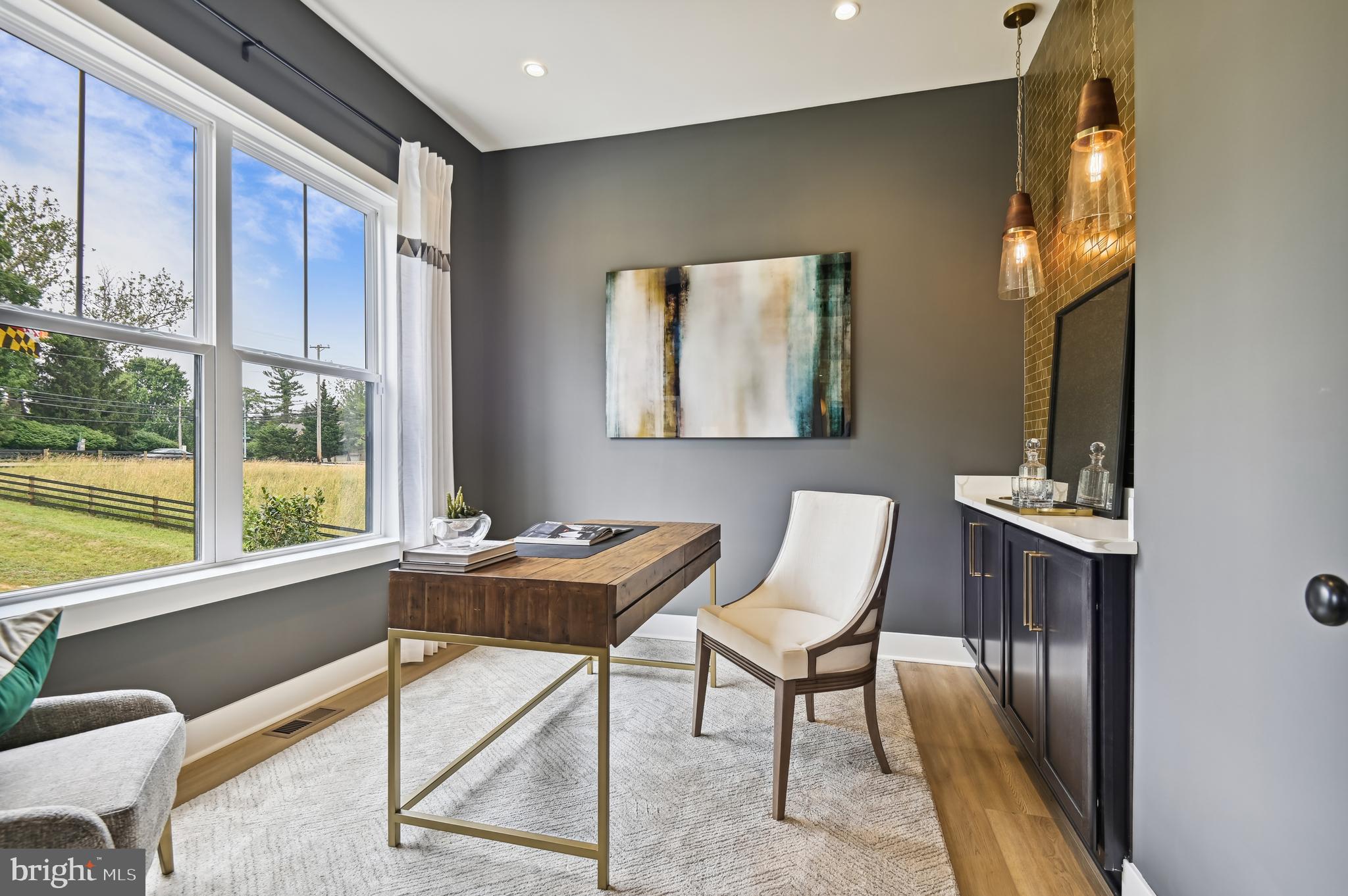 6112 Clarks Lane Baltimore, MD 21209 - Photo 11 of 40 a view of a workspace with furniture and a window