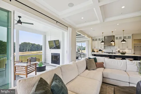 a living room with furniture fireplace and flat screen tv