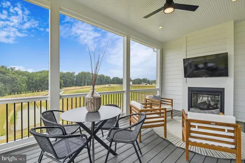 a view of a chairs and table in patio