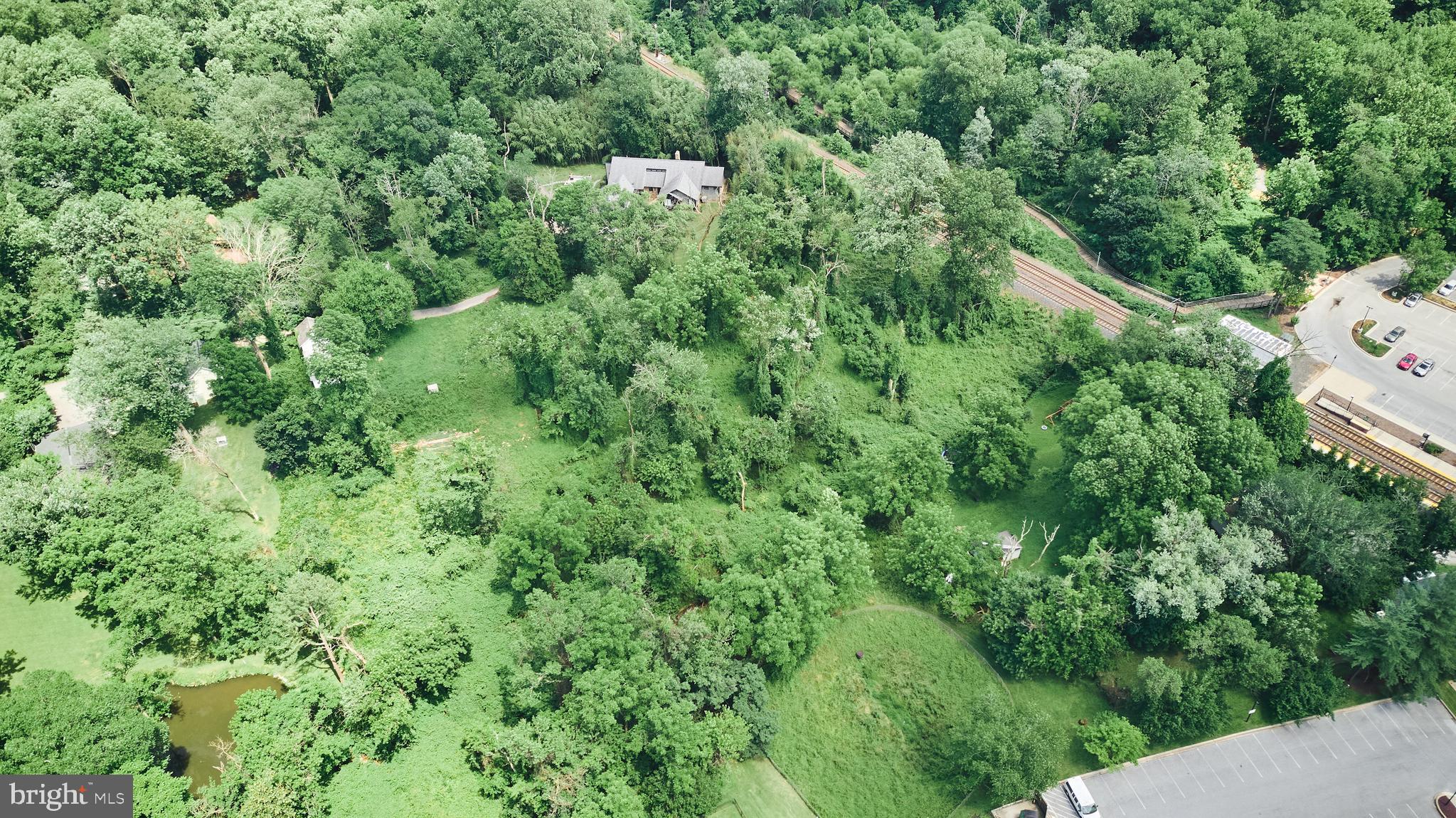 6112 Clarks Lane Baltimore, MD 21209 - Photo 2 of 40 an aerial view of residential house with outdoor space and trees all around