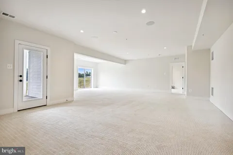 a view of livingroom with furniture and toys