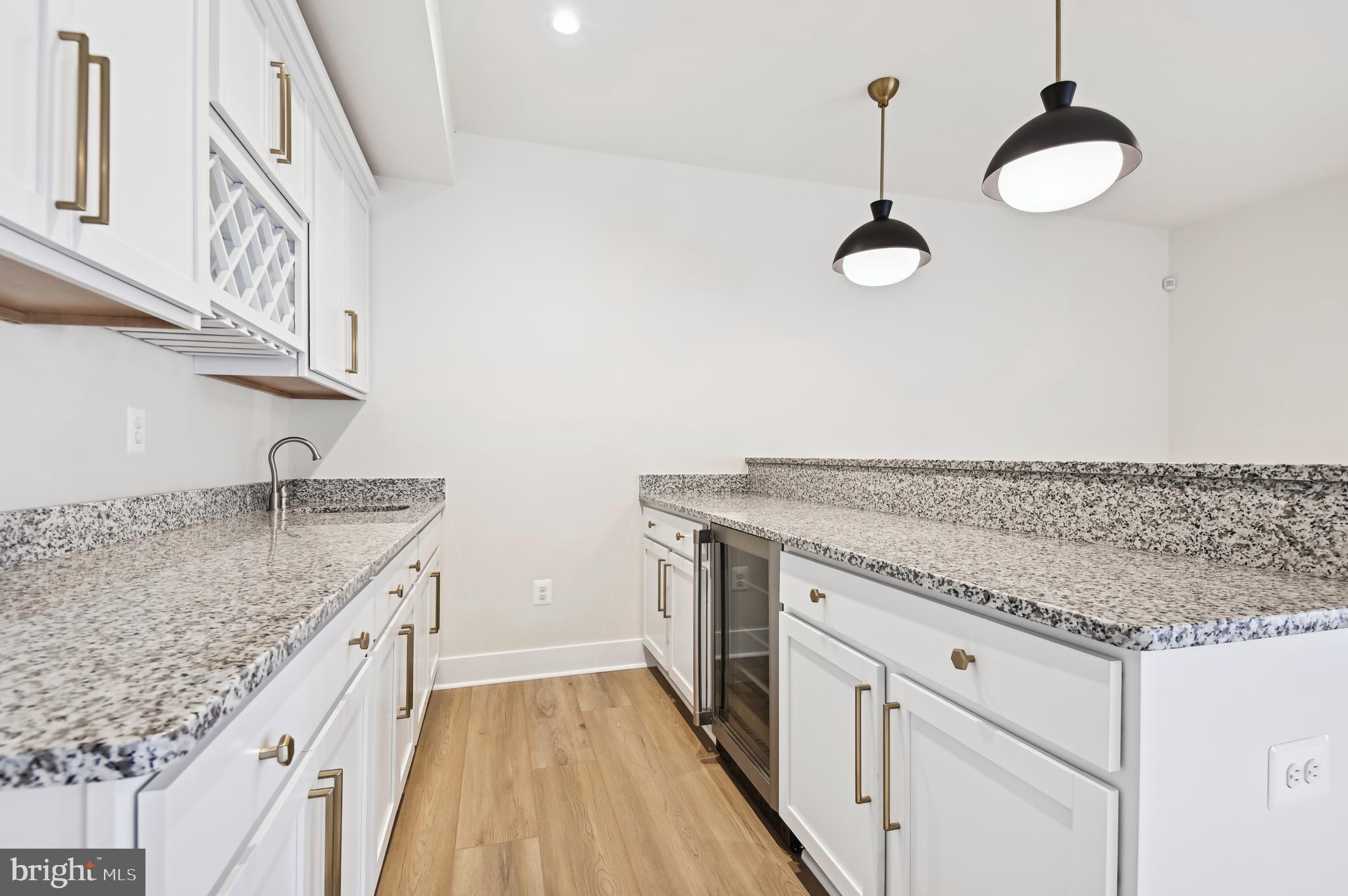 6112 Clarks Lane Baltimore, MD 21209 - Photo 31 of 40 a kitchen with granite countertop cabinets a sink and dishwasher