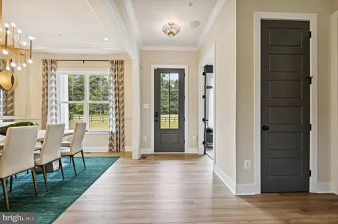 a view of a livingroom with furniture window and wooden floor