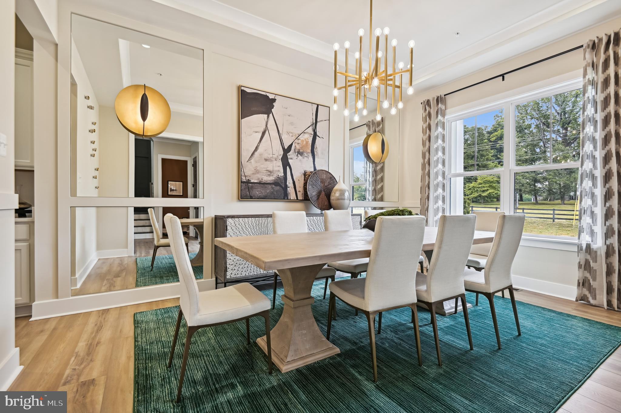 6112 Clarks Lane Baltimore, MD 21209 - Photo 9 of 40 a view of a dining room with furniture a chandelier and wooden floor