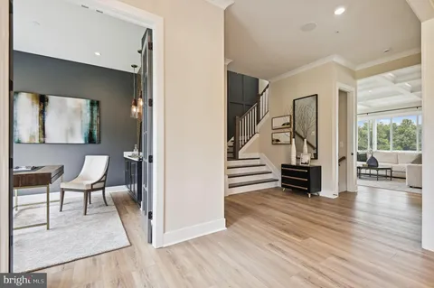 a view of dining room with furniture and wooden floor