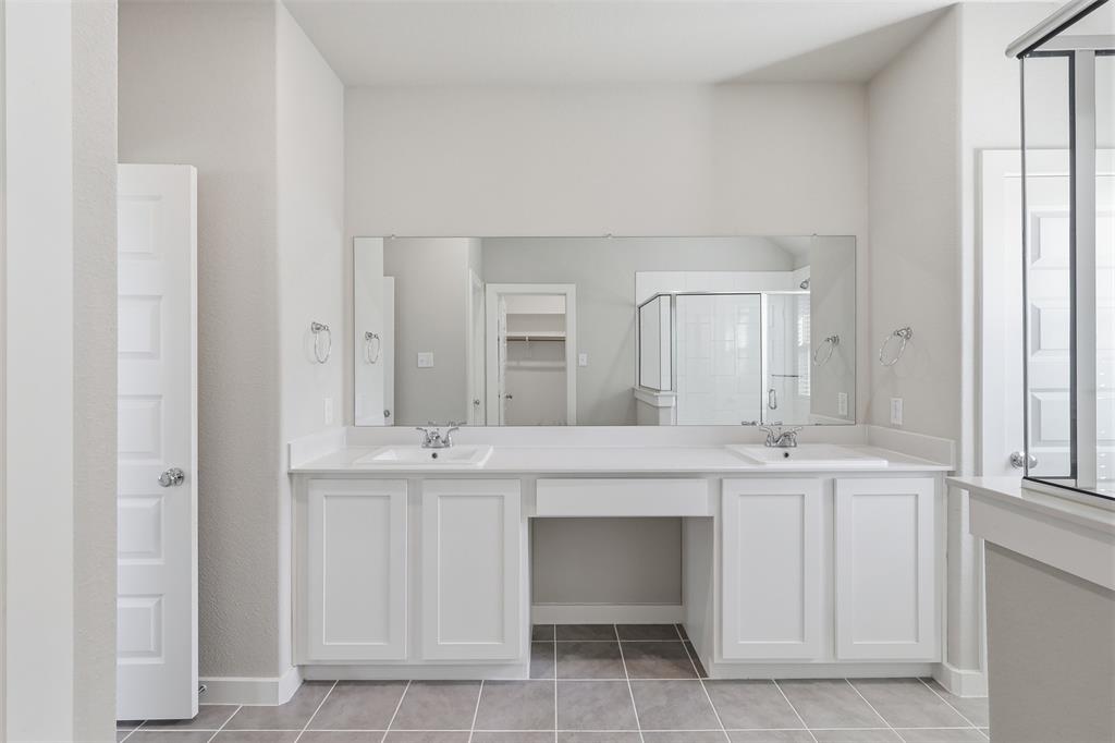 2629 Green River Road Royse City, TX 75189 - Photo 16 of 18 a spacious bathroom with a sink and a mirror