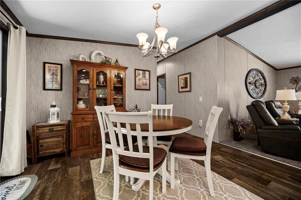 73 South Summit Road, Unit 510 Greenville, PA 16125 - Photo 14 of 33 a view of a dining room with furniture and wooden floor